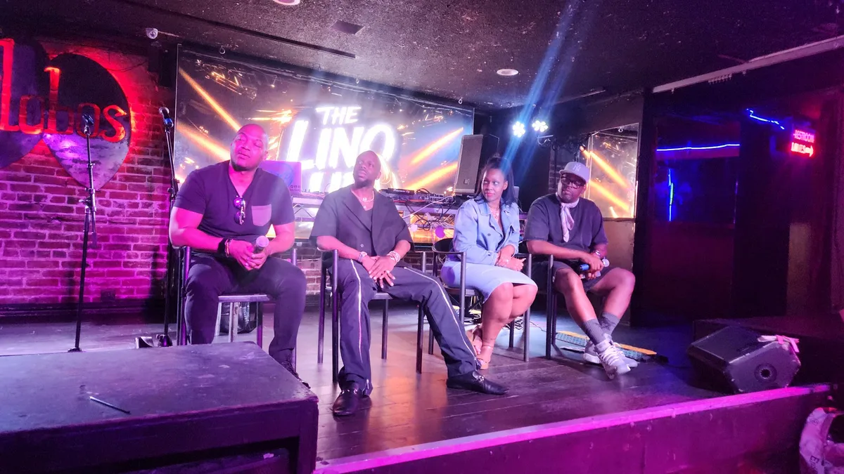 Four panelists seated on the Los Globos stage beneath The Linq Up screen during BET Awards Weekend